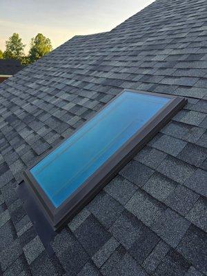watertight seal on new shingle roof around skylight