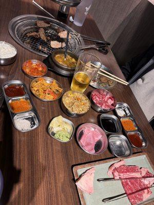 Bbq at table. Nice ribeye cut. Soup. Rices, Korean side dishes. Dips