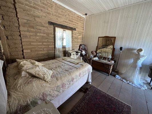 Brothel - notice the coins on the bed