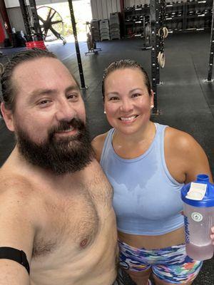The hubs and I after a great workout. Hot but still smiling.