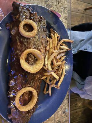 Full rack of ribs with a side of french fries