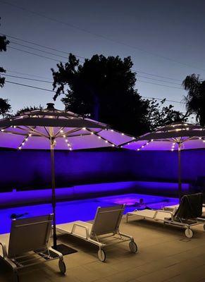Night time view with LED lights in pool and spa