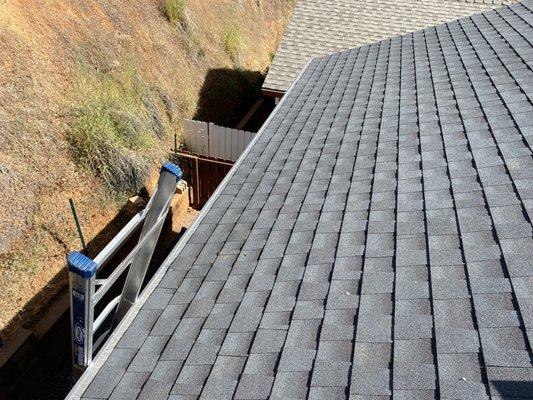 Stainless steel gutter guards installed with new gutters on this roof covering.