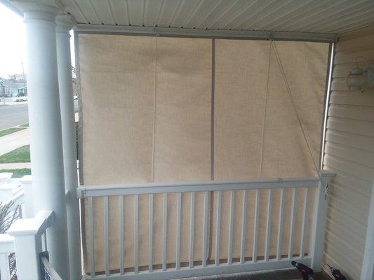 Add a roll up/drop curtain to your porch or covered deck.