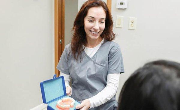 Your Framingham dentist with a patient