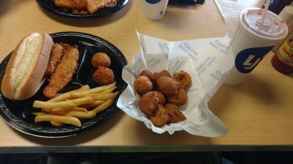 Fish sandwich, chicken, hushpuppies, fries, cinnapups, fruit punch.