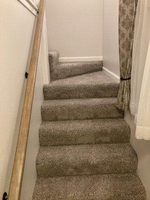 Carpet is beautifully installed. Tight and flawless on every step.