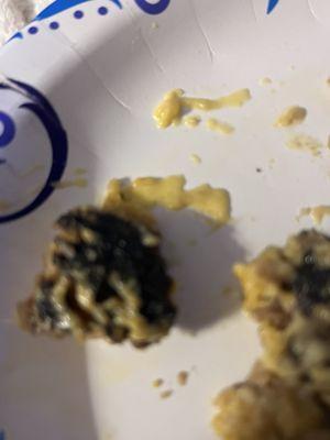 burned stuffed mushroom caps. hard to tell in photo but it's black.