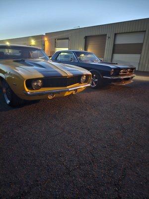 My Camaro sitting next to its arch nemesis at Auto Inn Storage during garage maintenance. Auto Inn storage #2 in the background