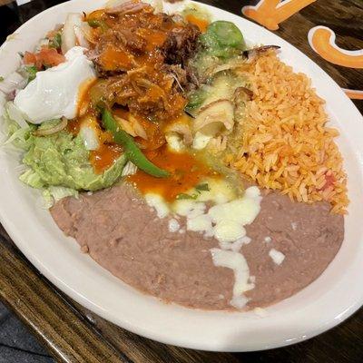 Carnitas enchiladas with red sauce