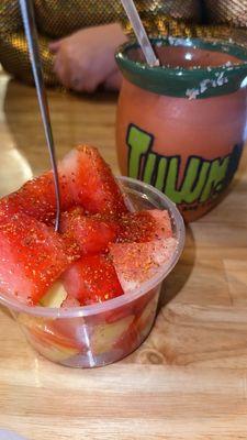 Fruit bowl with chamoy, lime and tajin.