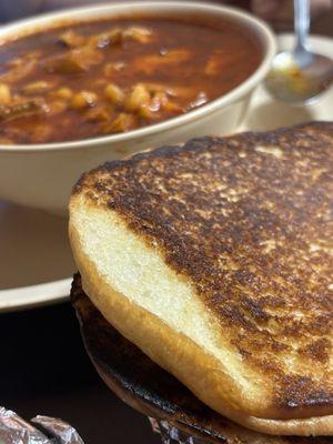 Menudo accompanied with bread (other option: tortillas)