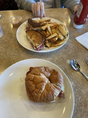 Breakfast sandwich on croissant  and Reuben on Marbled Rye