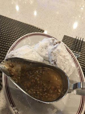 A surprise offering of beignets with a sample of salted pecan caramel sauce...