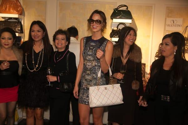 Guests taking photos with one of Maison Boutik's models.