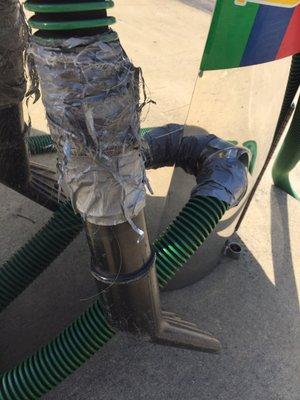 Duct tape repair job on the vacuum hose. Touch it and your hand gets sticky.