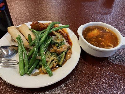 Various buffet foods and hot and sour soup