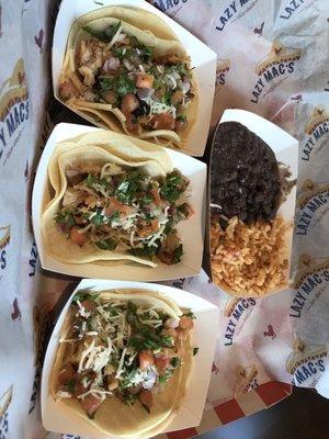 Pork belly tacos with rice and black beans.