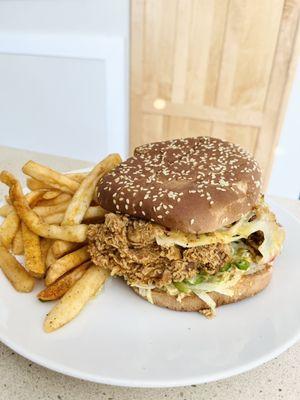 Chicken G's - Naughty Chick - pepper jack cheese, serrano chili, lettuce & the G sauce on a toasted sesame bun.