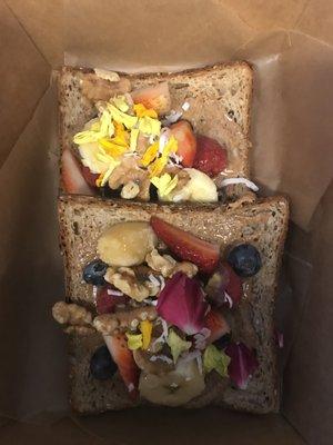 Toast With Almond Butter, fresh fruit and edible flowers