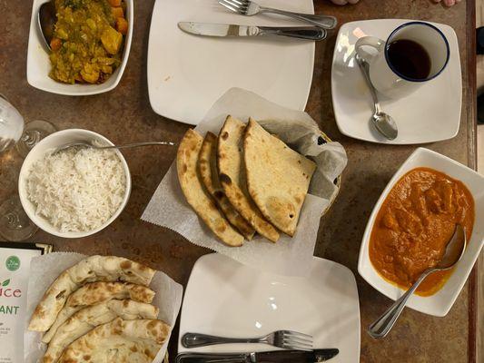 Tandoori Roti, Naan, Butter Chicken, Vegetable Curry.