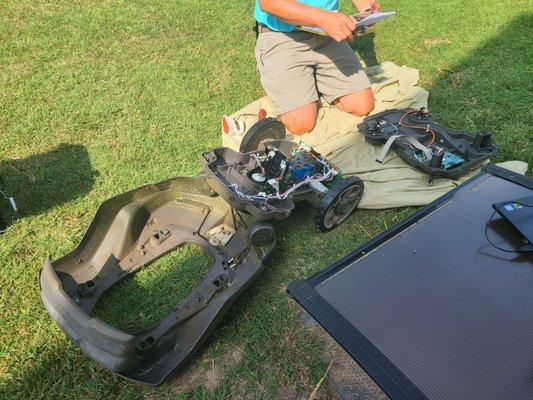 Chris saving the day, working on my automower.