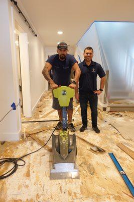Two of our crew members getting a engineered hardwood flooring removed. Thanks for the hard work guys.