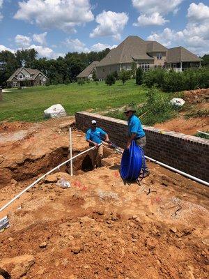 Laying pex pipe for a new pool house.