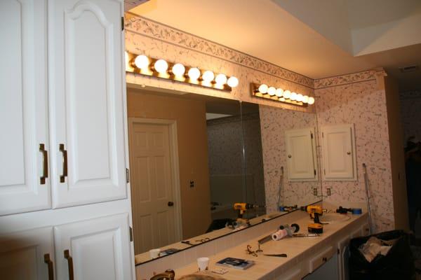 Replacing fixtures and removing wallpaper.