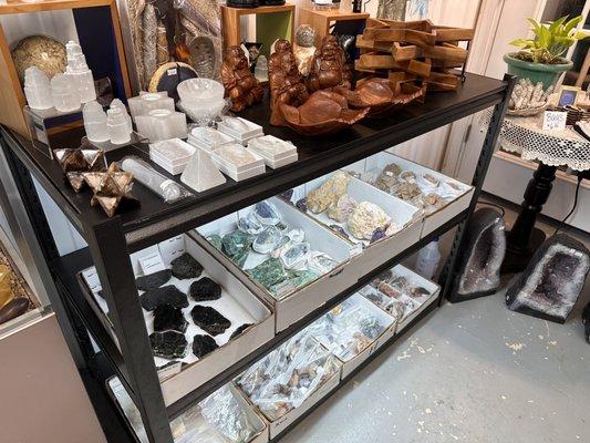 Selenite objects, various minerals, and Indonesian items.