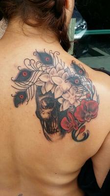 Work by Christine  The red orchids were a different color from another artist. She changed  to red for the new style I  wanted