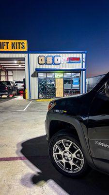 Renegade with a 2 inch lift in front of store.