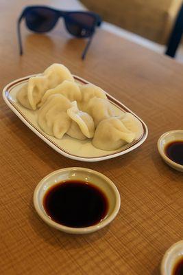 Pork and cabbage dumplings, served with vinegar