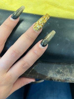 My gold middle finger nail that was fixed