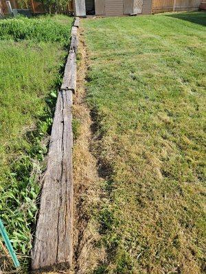 Another example of the quality work they do. No straight lines, chunks missing from lawn, etc.