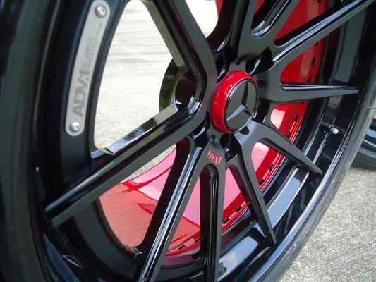 adv1 rims powdercoated gloss black lips with satin black spokes and a anodized red barrel