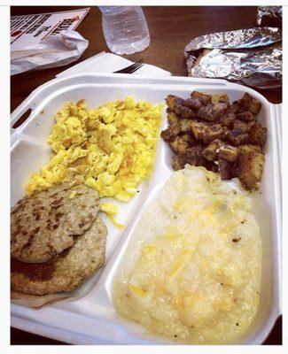 Scrambled eggs with cheese, turkey sausage patties, cheese grits and breakfast potatoes seasoned to perfection