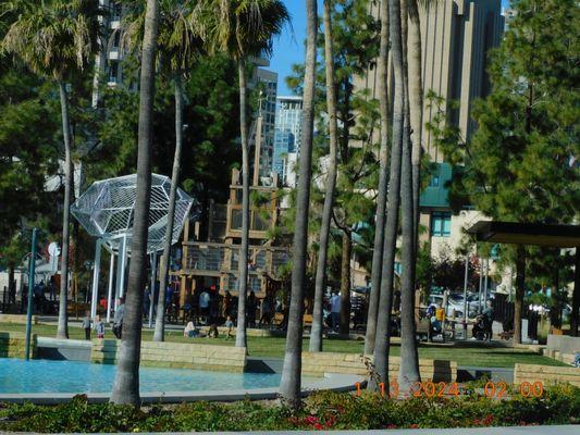 Where can you find a large art sculpture and the many areas made of wood and the climbing is for exercise.