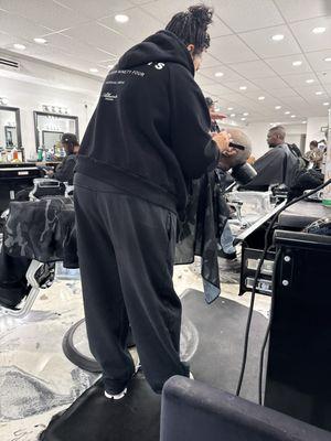 Mrs. B getting my Dad's hair and beard an overhaul because he looked like Santa when we came in.