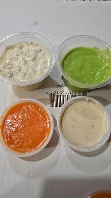 Small side of Baba Ganoush, Cilantro Avacado sauce, Tahini sauce, and Shattah hot sauce. All sauces are delicious.