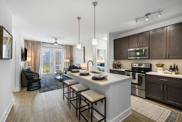 Apartment with wood cabinetry with a grey washed finish