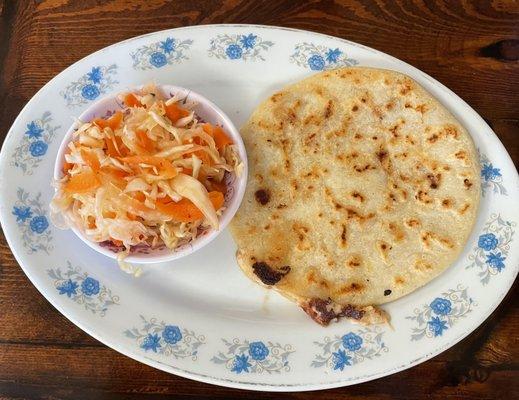 Bean and pork Papusa with a crisp slaw.