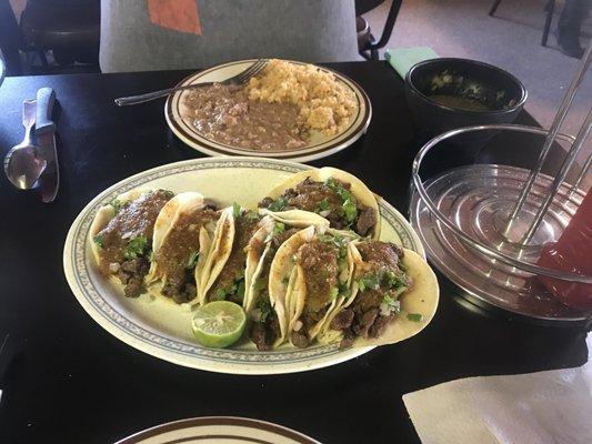 Carne asada taco's rice & beans on the side!