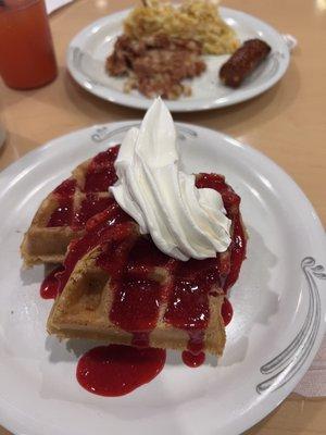 Waffles, strawberry syrup. Corn beef hash, turkey and cheese sausage link and hash browns.