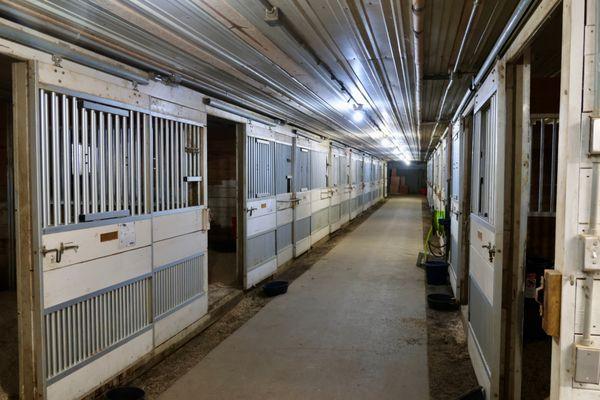 Heated 20-stall barn with tack room at EverRain Stables for comfortable, year-round boarding