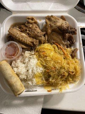 Chicken adobo lunch which comes with steam rice pancit and eggroll with sweet chili sauce