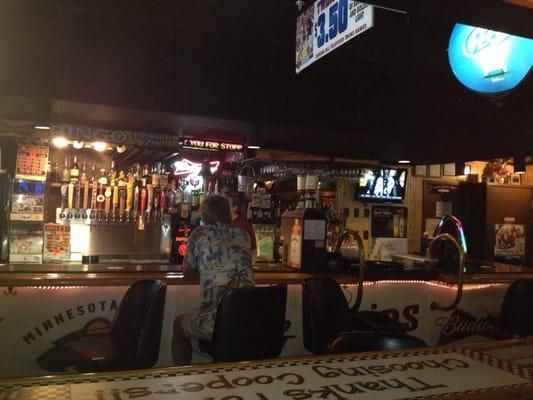 Having my very first Juicy Lucy burger and washing it down with a Sury. Local feel and a great place to watch sports.