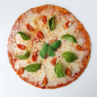 margherita pizza: organic crust, organic sauce, mozzarella cheese, cherry tomatoes, fresh basil, olive oil. $6,75