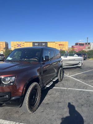 My Land Rover and open bow boat