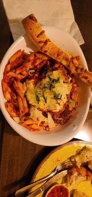 Baked chicken Parmesan on ziti pasta with marinara sauce